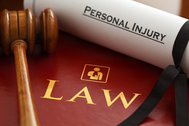 Insurance card, medical paperwork, and auto policy documents on a desk
