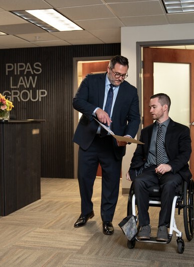 Pipas Law Group team meeting with a client